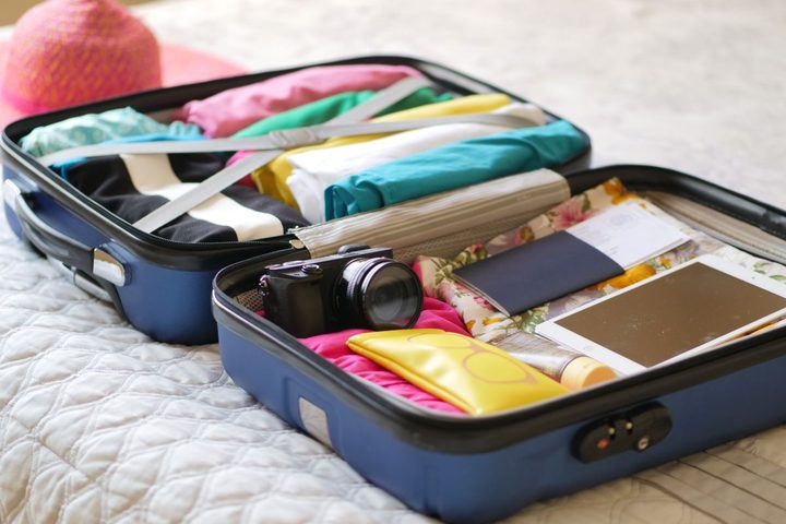 A packed suitcase with personal belongings