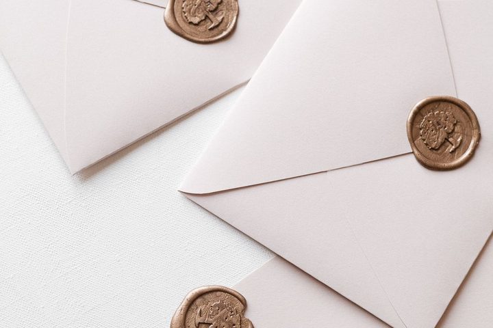 White envelopes with wax seals on a table